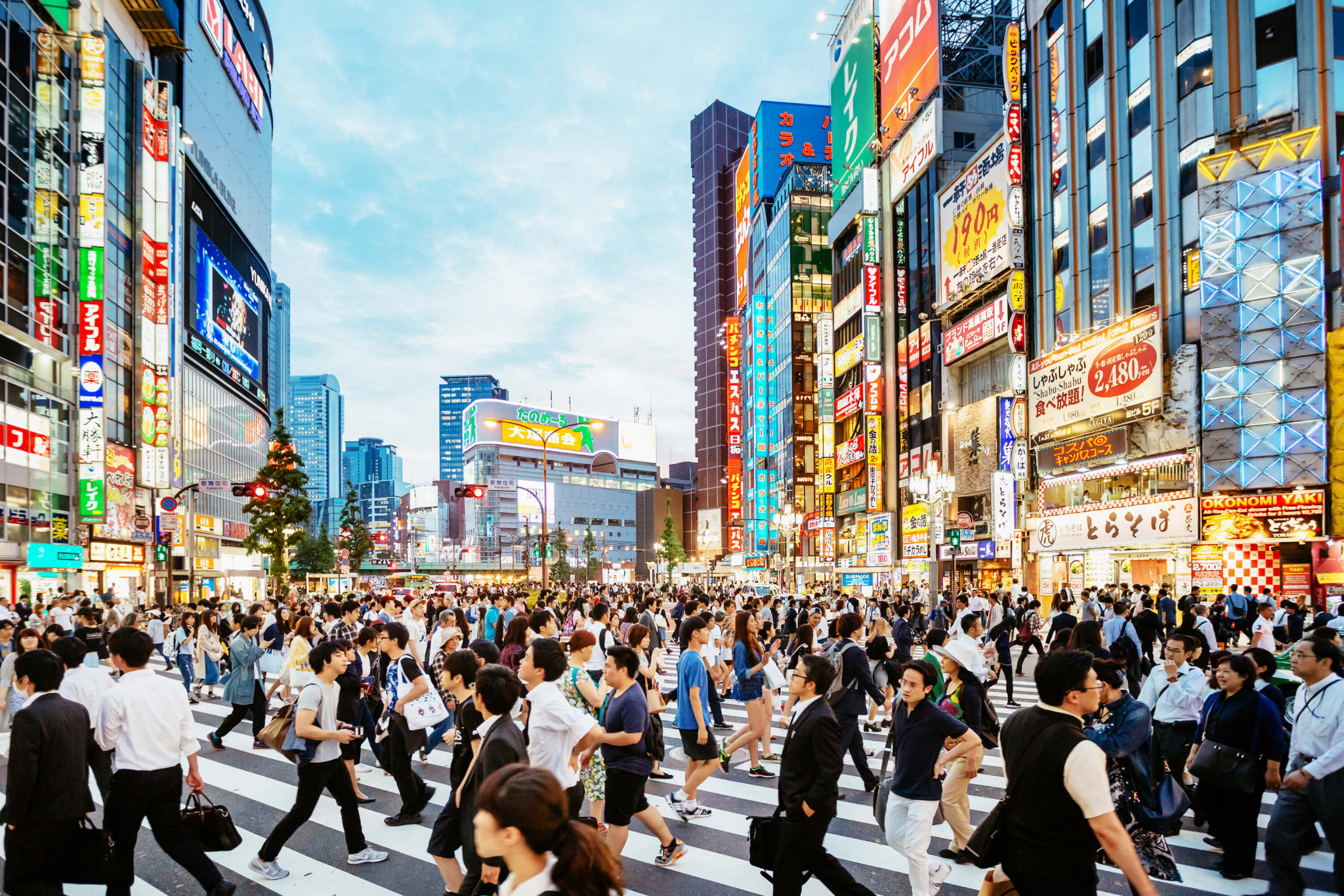 people rushing through busy street in Tokyo